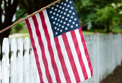 American flag on fence