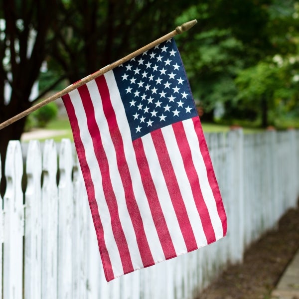 American flag on fence
